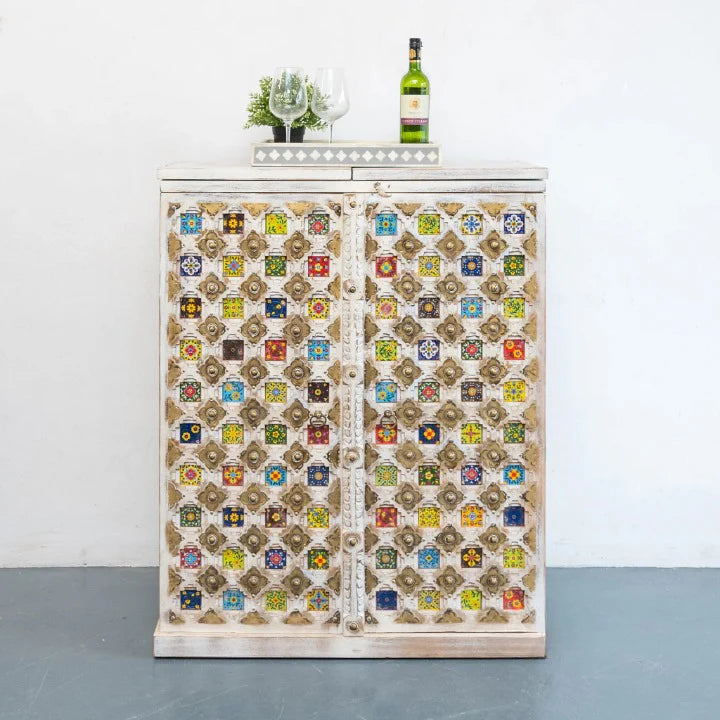 handmade bar cabinet, mango wood bar cabinet, moroccan tile cabinet, whitewashed bar cabinet, ceramic tile inlay, brass work cabinet, wine cabinet, liquor cabinet, home bar cabinet, dining room bar cabinet, living room bar cabinet, storage cabinet, 2 door cabinet, 2 drawer cabinet, wine rack cabinet, display shelf cabinet, artisan made cabinet, premium wood cabinet, quality wood furniture, durable bar cabinet, sturdy cabinet, elegant bar cabinet, statement bar cabinet, moroccan style cabinet, global style c