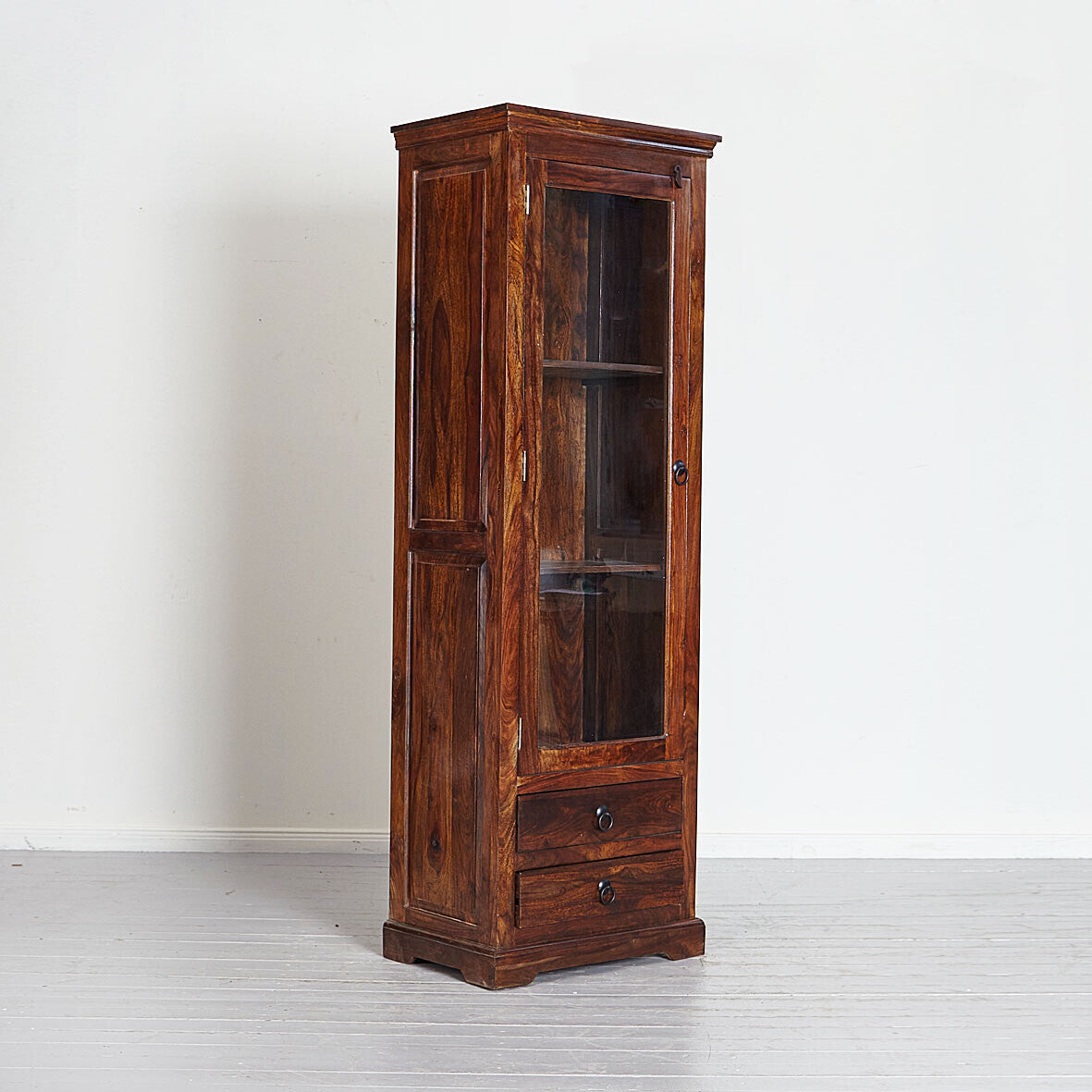 Wooden cabinet with glass door and drawers on a white background