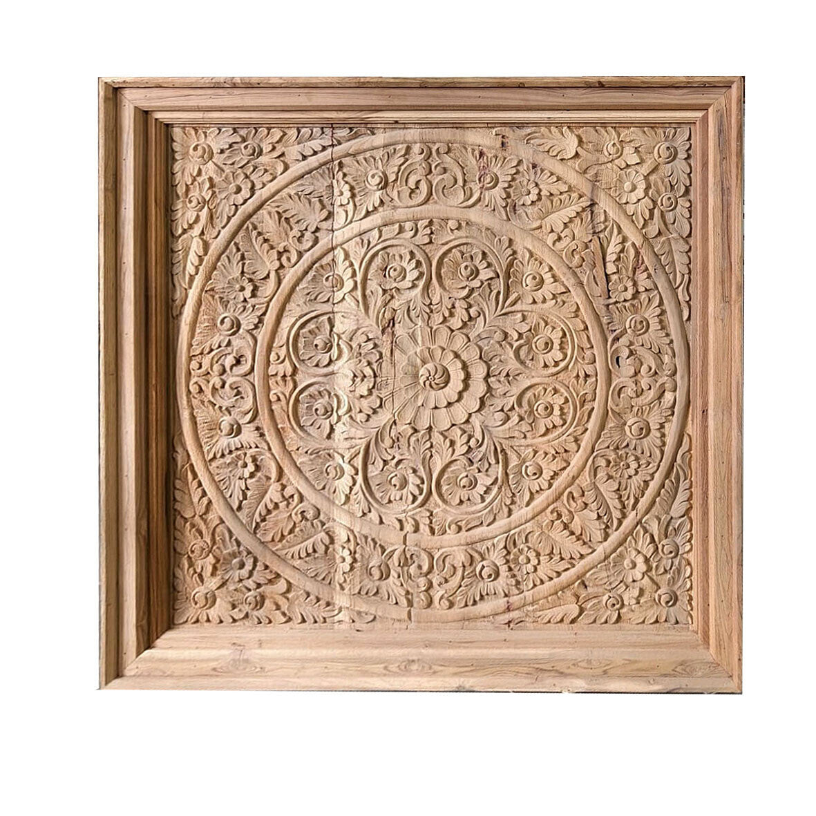 Wooden panel with intricate carvings on a white background