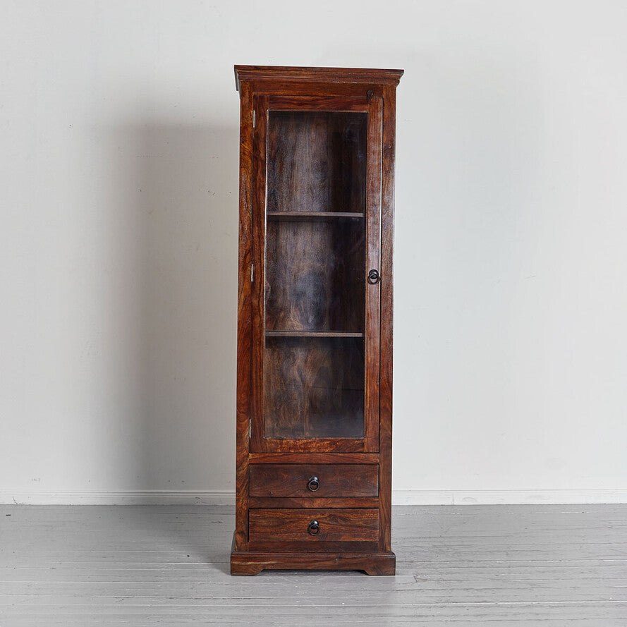 Wooden cabinet with glass door and drawer on a plain background