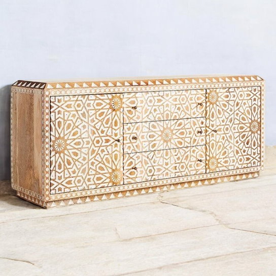White buffet cabinet with mid-century design elements.
