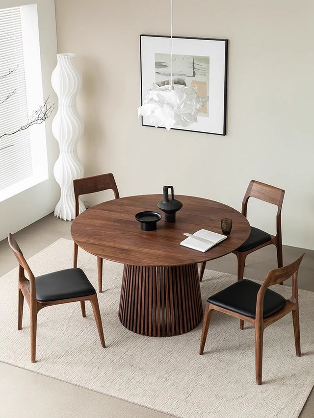Elegant round dining table with modern design
