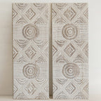 "Set of two whitewashed mango wood wall panels showing organic texture and carvings"

