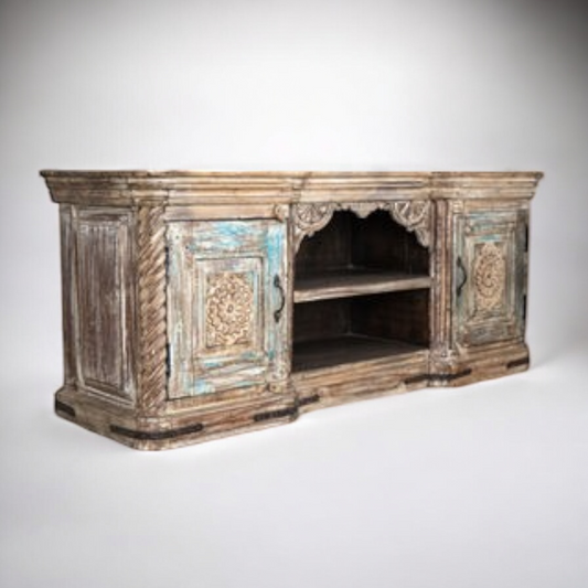 Carved wood media console featuring intricate designs, combining functionality and elegance,