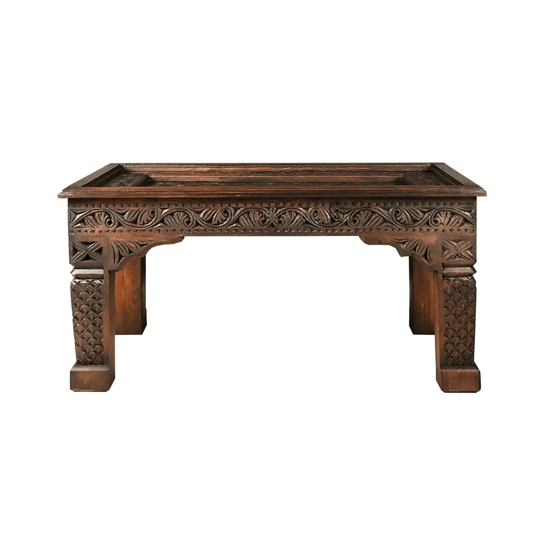 hand carved coffee table, mango wood coffee table, walnut coffee table, carved wood table, rectangular coffee table, indian furniture, living room table, statement coffee table, handmade coffee table, artisan made table, premium wood table, quality furniture, durable table, sturdy table, timeless table, elegant table, ornate table, unique table, sculptural table, focal piece table, handcrafted in india, sustainable mango wood, rich walnut finish, walnut stain, geometric patterns, scrolling vines, scrolling 