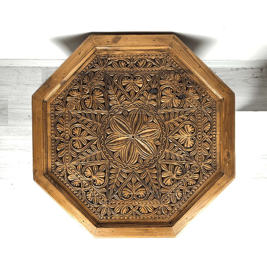 hand carved coffee table, solid wood coffee table, octagonal coffee table, carved wood table, natural wood table, indian furniture, living room table, statement coffee table, mehrab arch table, handmade coffee table, artisan made table, premium wood table, quality furniture, durable table, sturdy table, timeless table, elegant table, ornate table, unique table, sculptural table, focal piece table, handcrafted in india, sustainable wood furniture, star medallion design, geometric patterns, scrolling vines, f
