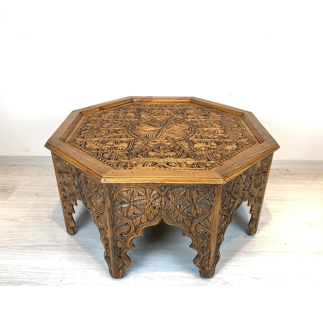 hand carved coffee table, solid wood coffee table, octagonal coffee table, carved wood table, natural wood table, indian furniture, living room table, statement coffee table, mehrab arch table, handmade coffee table, artisan made table, premium wood table, quality furniture, durable table, sturdy table, timeless table, elegant table, ornate table, unique table, sculptural table, focal piece table, handcrafted in india, sustainable wood furniture, star medallion design, geometric patterns, scrolling vines, f