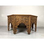 hand carved coffee table, solid wood coffee table, octagonal coffee table, carved wood table, natural wood table, indian furniture, living room table, statement coffee table, mehrab arch table, handmade coffee table, artisan made table, premium wood table, quality furniture, durable table, sturdy table, timeless table, elegant table, ornate table, unique table, sculptural table, focal piece table, handcrafted in india, sustainable wood furniture, star medallion design, geometric patterns, scrolling vines, f