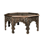hand carved coffee table, solid wood coffee table, octagonal coffee table, carved wood table, indian furniture, living room table, statement coffee table, mehrab arch table, handmade coffee table, artisan made table, premium wood table, quality furniture, durable table, sturdy table, timeless table, elegant table, ornate table, unique table, sculptural table, focal piece table, handcrafted in india, sustainable wood furniture, star medallion design, geometric patterns, scrolling vines, floral rosettes, mehr