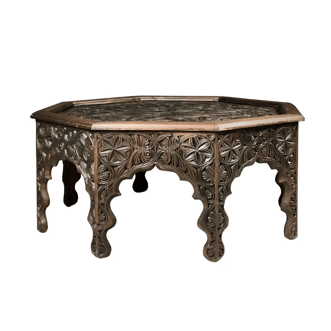 hand carved coffee table, solid wood coffee table, octagonal coffee table, carved wood table, indian furniture, living room table, statement coffee table, mehrab arch table, handmade coffee table, artisan made table, premium wood table, quality furniture, durable table, sturdy table, timeless table, elegant table, ornate table, unique table, sculptural table, focal piece table, handcrafted in india, sustainable wood furniture, star medallion design, geometric patterns, scrolling vines, floral rosettes, mehr