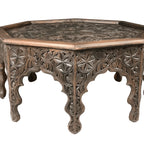 hand carved coffee table, solid wood coffee table, octagonal coffee table, carved wood table, indian furniture, living room table, statement coffee table, mehrab arch table, handmade coffee table, artisan made table, premium wood table, quality furniture, durable table, sturdy table, timeless table, elegant table, ornate table, unique table, sculptural table, focal piece table, handcrafted in india, sustainable wood furniture, star medallion design, geometric patterns, scrolling vines, floral rosettes, mehr