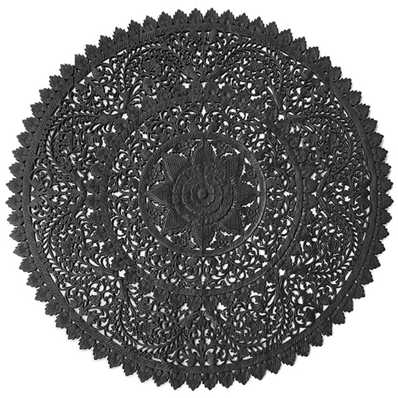 "Close-up of hand-carved black wood texture showing artisan details and depth"

