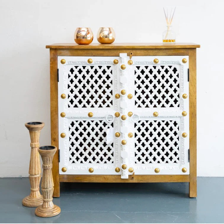 hand carved sideboard, mango wood sideboard, 2 door sideboard, two tone sideboard, white and natural sideboard, lattice carved sideboard, brass stud sideboard, openwork sideboard, indian carved furniture, storage sideboard, dining room sideboard, living room sideboard, bedroom sideboard, entryway sideboard, accent sideboard, statement sideboard, compact sideboard, handmade sideboard, artisan made sideboard, premium wood sideboard, quality wood furniture, durable sideboard, sturdy sideboard, timeless sideboa