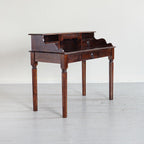 Wooden desk with a shelf and drawers on a white background