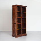 Wooden bookshelf with multiple shelves on a white background