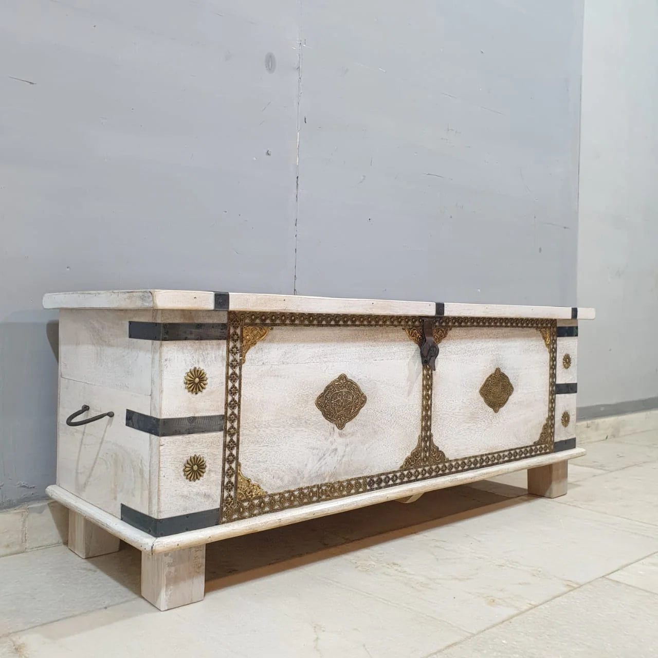 hand carved blanket box, wooden trunk, whitewashed blanket box, brass fittings box, brass medallion trunk, blanket trunk, linen chest, indian furniture, bedroom blanket box, living room trunk, entryway chest, storage bench, coffee table trunk, handmade blanket box, artisan made trunk, premium wood chest, quality wood furniture, durable trunk, sturdy blanket box, timeless chest, elegant trunk, statement blanket box, heirloom chest, mughal style trunk, vintage blanket box, eclectic chest, coastal trunk, rusti
