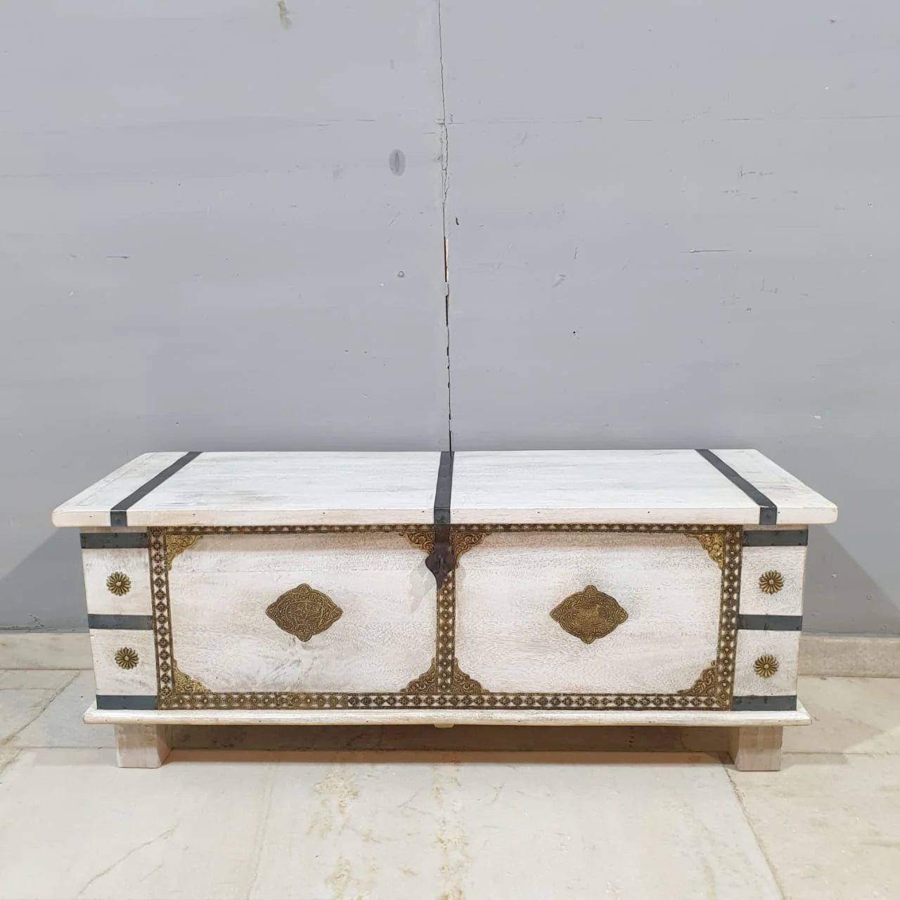 hand carved blanket box, wooden trunk, whitewashed blanket box, brass fittings box, brass medallion trunk, blanket trunk, linen chest, indian furniture, bedroom blanket box, living room trunk, entryway chest, storage bench, coffee table trunk, handmade blanket box, artisan made trunk, premium wood chest, quality wood furniture, durable trunk, sturdy blanket box, timeless chest, elegant trunk, statement blanket box, heirloom chest, mughal style trunk, vintage blanket box, eclectic chest, coastal trunk, rusti