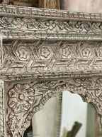 mango wood mirror, carved mirror, mehrab mirror, arched mirror, islamic mirror, moroccan mirror, distressed mirror, white mirror, rustic mirror, antique mirror, wall mirror, statement mirror, architectural mirror, jali mirror, mughal mirror, traditional mirror, handmade mirror, artisan mirror, premium mirror, quality mirror, durable mirror, elegant mirror, unique mirror, decorative mirror, focal piece mirror, handcrafted in india, sustainable mango wood, distressed white, white finish, rustic antiquing, war