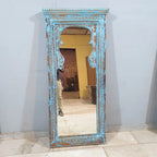 hand carved mirror, wooden frame mirror, rustic blue mirror, turquoise mirror, distressed blue mirror, full length mirror, wall mirror, mehrab arch mirror, arched mirror, entryway mirror, narrow mirror, dressing mirror, decorative mirror, indian furniture, handmade mirror, artisan made mirror, premium wood mirror, quality mirror, durable mirror, sturdy mirror, timeless mirror, elegant mirror, statement mirror, ornate mirror, unique mirror, sculptural mirror, focal piece mirror, handcrafted in india, sustain
