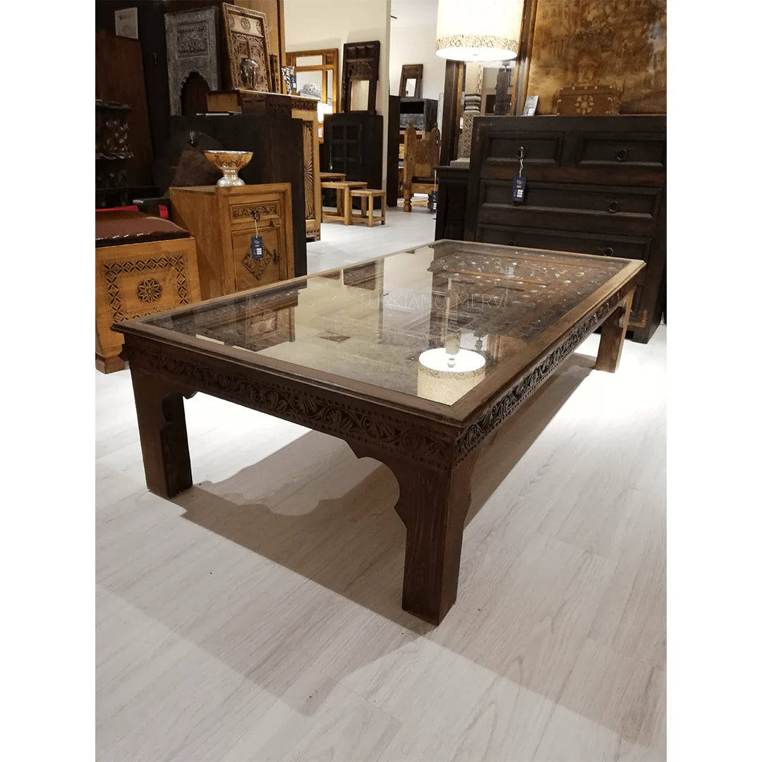 hand carved coffee table, solid wood coffee table, large coffee table, carved wood table, rectangular coffee table, indian furniture, living room table, statement coffee table, handmade coffee table, artisan made table, premium wood table, quality furniture, durable table, sturdy table, timeless table, elegant table, ornate table, unique table, sculptural table, focal piece table, handcrafted in india, sustainable wood furniture, warm wood finish, geometric borders, floral rosettes, scrolling acanthus, six 