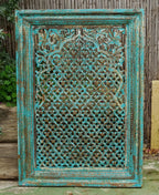 hand carved wall panel, mango wood wall art, distressed turquoise panel, jali carved panel, openwork wall hanging, quatrefoil lattice panel, jali wall art, indian furniture, living room wall art, bedroom wall decor, entryway wall panel, decorative wall panel, handmade wall art, artisan made panel, premium wood art, quality wood decor, durable wall panel, timeless wall art, elegant panel, statement wall decor, decorative panel, unique wall art, sculptural panel, focal piece art, handcrafted in india, sustain