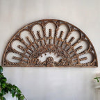 Close-up of traditional carvings on 183cm wide wooden wall decor
