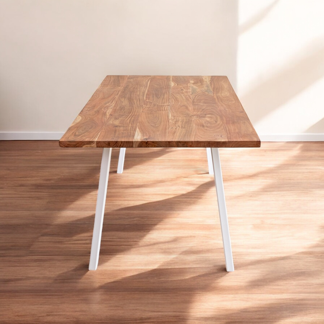 Sturdy wood dining table with a rustic finish in a farmhouse-inspired space.
