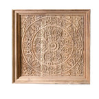 Wooden panel with intricate carvings on a white background