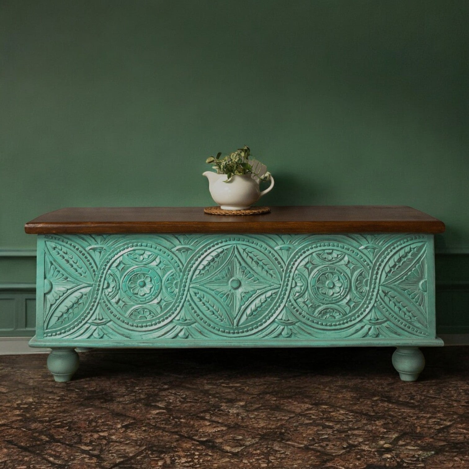 Handcrafted mango wood chest with teal distressed finish, natural wood lid, and ornate carvings.
