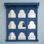 mango wood mirror, jharokha mirror, nine arch mirror, grid mirror panel, indian mirror, blue mirror, distressed blue, carved mirror, wall mirror, statement mirror, palace mirror, scalloped arches, foliate carving, rope border, vine border, baluster brackets, crown cornice, architectural decor, boho decor, global eclectic, vintage inspired, artisan made, handcrafted in india, solid wood frame, large wall mirror, square mirror, entryway decor, living room decor, dining wall, stair landing, heritage decor, ind