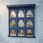 mango wood mirror, jharokha mirror, nine arch mirror, grid mirror panel, indian mirror, blue mirror, distressed blue, carved mirror, wall mirror, statement mirror, palace mirror, scalloped arches, foliate carving, rope border, vine border, baluster brackets, crown cornice, architectural decor, boho decor, global eclectic, vintage inspired, artisan made, handcrafted in india, solid wood frame, large wall mirror, square mirror, entryway decor, living room decor, dining wall, stair landing, heritage decor, ind