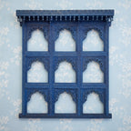 mango wood mirror, jharokha mirror, nine arch mirror, grid mirror panel, indian mirror, blue mirror, distressed blue, carved mirror, wall mirror, statement mirror, palace mirror, scalloped arches, foliate carving, rope border, vine border, baluster brackets, crown cornice, architectural decor, boho decor, global eclectic, vintage inspired, artisan made, handcrafted in india, solid wood frame, large wall mirror, square mirror, entryway decor, living room decor, dining wall, stair landing, heritage decor, ind