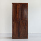 Wooden cabinet with a dark brown finish on a white background