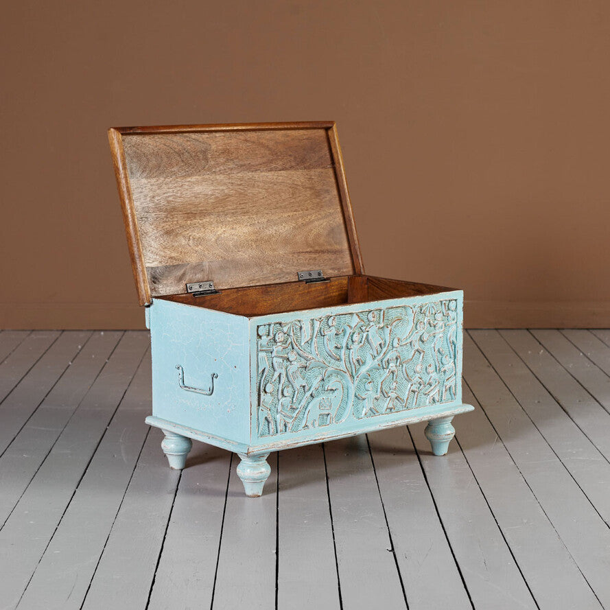 Compact coffee table chest with tree‑of‑life carved panel, blue finish, natural wood top.

