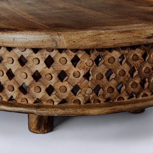 "Burl coffee table with striking natural grain patterns, a centerpiece for contemporary or eclectic living spaces."
