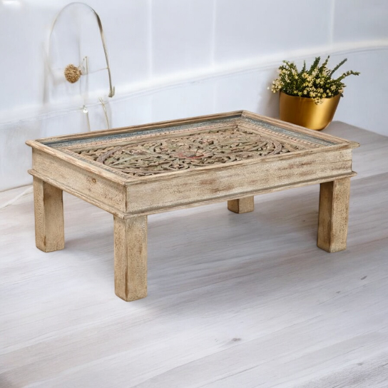 Farmhouse coffee table in a cozy living room with country-inspired decor.
