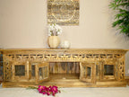 hand carved tv unit, solid mango wood tv stand, glossy timber tv unit, natural wood media console, openwork carved tv stand, 6 door tv unit, glass door tv stand, living room tv unit, entertainment center, tv cabinet, carved wood furniture, traditional tv stand, indian carved tv unit, statement media console, large tv stand, storage tv unit, handmade tv console, artisan made tv unit, premium wood furniture, quality wood tv stand, durable tv unit, sturdy media console, timeless tv stand, elegant tv unit, gran