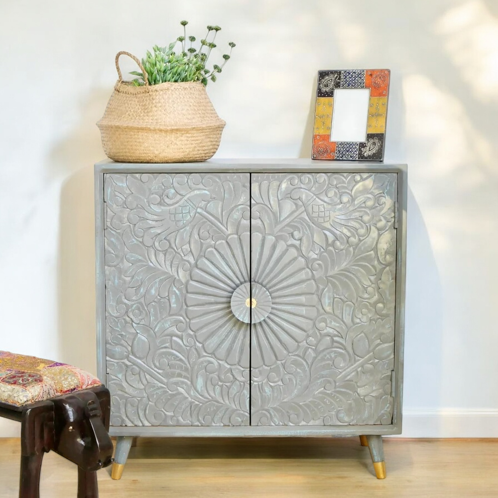 Small cabinet with doors for concealed storage in a living room.
