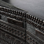 Close-up of unique detailed carvings on the doors of a dark solid wood Tabwa cabinet - Jodhpur handcrafted furniture

