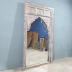 hand carved mirror, mango wood mirror, rustic white mirror, distressed white mirror, large mirror, oversized mirror, full length mirror, wall mirror, mehrab arch mirror, arched mirror, jali lattice mirror, entryway mirror, dressing mirror, decorative mirror, indian furniture, handmade mirror, artisan made mirror, premium wood mirror, quality mirror, durable mirror, sturdy mirror, timeless mirror, elegant mirror, statement mirror, ornate mirror, unique mirror, sculptural mirror, focal piece mirror, handcraft
