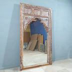 hand carved mirror, mango wood mirror, rustic white mirror, distressed white mirror, large mirror, oversized mirror, full length mirror, wall mirror, mehrab arch mirror, arched mirror, jali lattice mirror, entryway mirror, dressing mirror, decorative mirror, indian furniture, handmade mirror, artisan made mirror, premium wood mirror, quality mirror, durable mirror, sturdy mirror, timeless mirror, elegant mirror, statement mirror, ornate mirror, unique mirror, sculptural mirror, focal piece mirror, handcraft