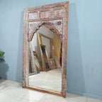 hand carved mirror, mango wood mirror, rustic white mirror, distressed white mirror, large mirror, oversized mirror, full length mirror, wall mirror, mehrab arch mirror, arched mirror, jali lattice mirror, entryway mirror, dressing mirror, decorative mirror, indian furniture, handmade mirror, artisan made mirror, premium wood mirror, quality mirror, durable mirror, sturdy mirror, timeless mirror, elegant mirror, statement mirror, ornate mirror, unique mirror, sculptural mirror, focal piece mirror, handcraft