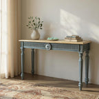 Console table with decorative items in a room with sunlight streaming through a window.