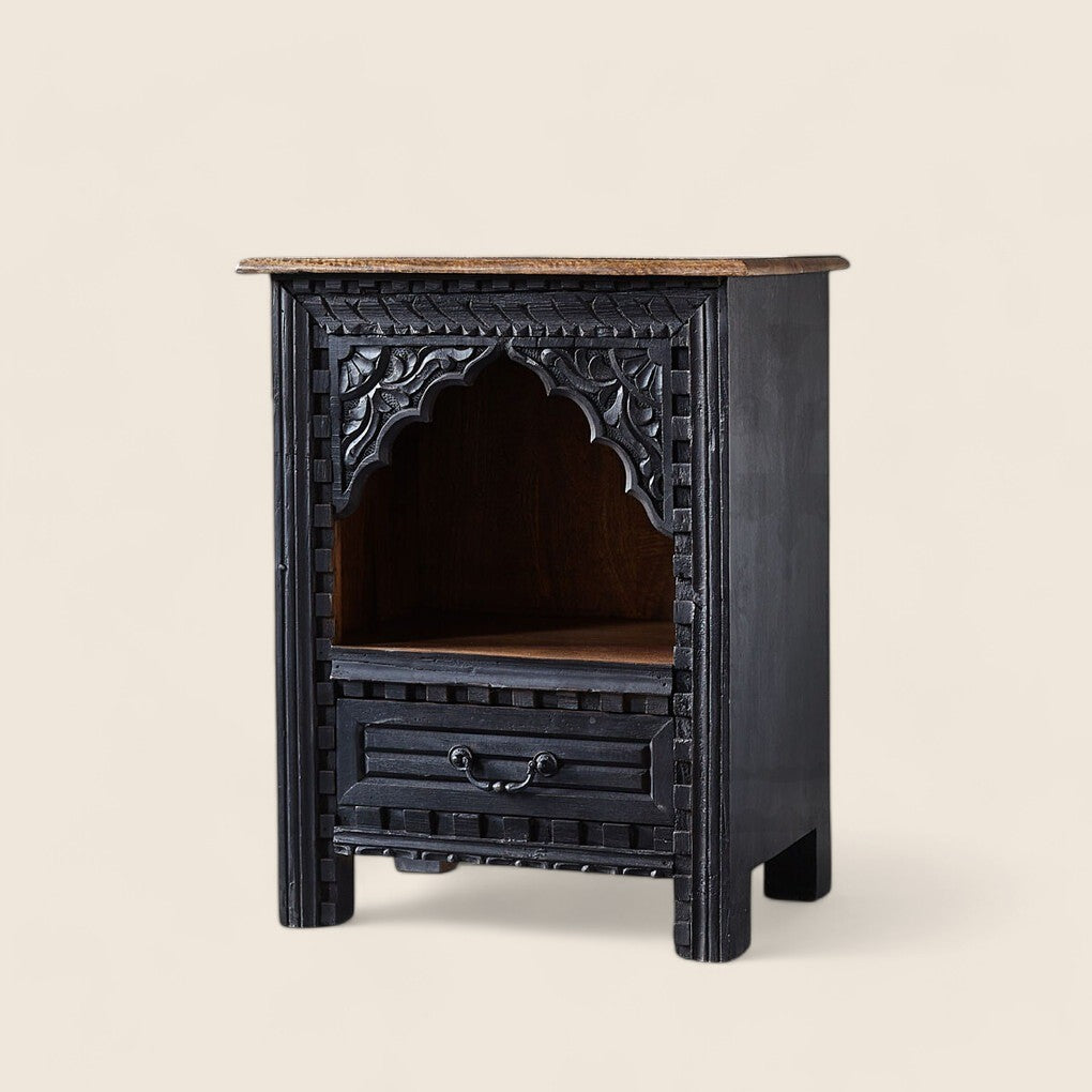Compact bedside table with drawers for essentials.
