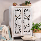 Small cabinet with doors for concealed storage in a living room.

