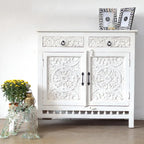 hand carved cabinet, mango wood cabinet, white cabinet, 2 door cabinet, 2 drawer cabinet, lotus carved cabinet, medallion carved cabinet, indian carved furniture, storage cabinet, dining room cabinet, living room cabinet, bedroom cabinet, entryway cabinet, sideboard cabinet, accent cabinet, handmade cabinet, artisan made cabinet, premium wood cabinet, quality wood furniture, durable cabinet, sturdy cabinet, timeless cabinet, elegant cabinet, statement cabinet, heirloom cabinet, coastal cabinet, shabby chic 