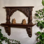 Jodhpur artisan dark wood carved archway wall altar, featuring intricate temple-inspired carvings. Ideal for displaying sacred items or antique collectibles.